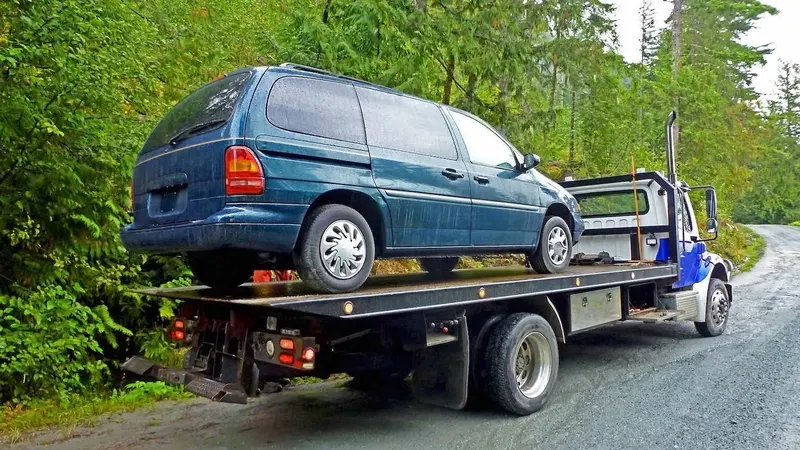Gatineau flatbed towing a cargo van
